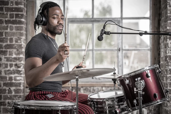 Drummer wearing Shure Headphones